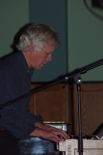 Hugh Banton behind the small organ