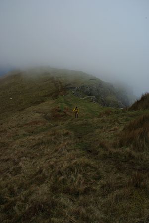 Michel walks over the mountain ridge